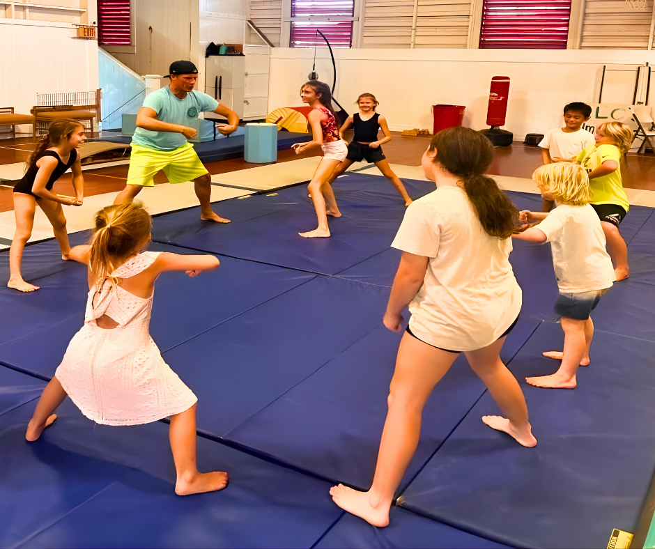 Coach Kevin leading dynamic class with students